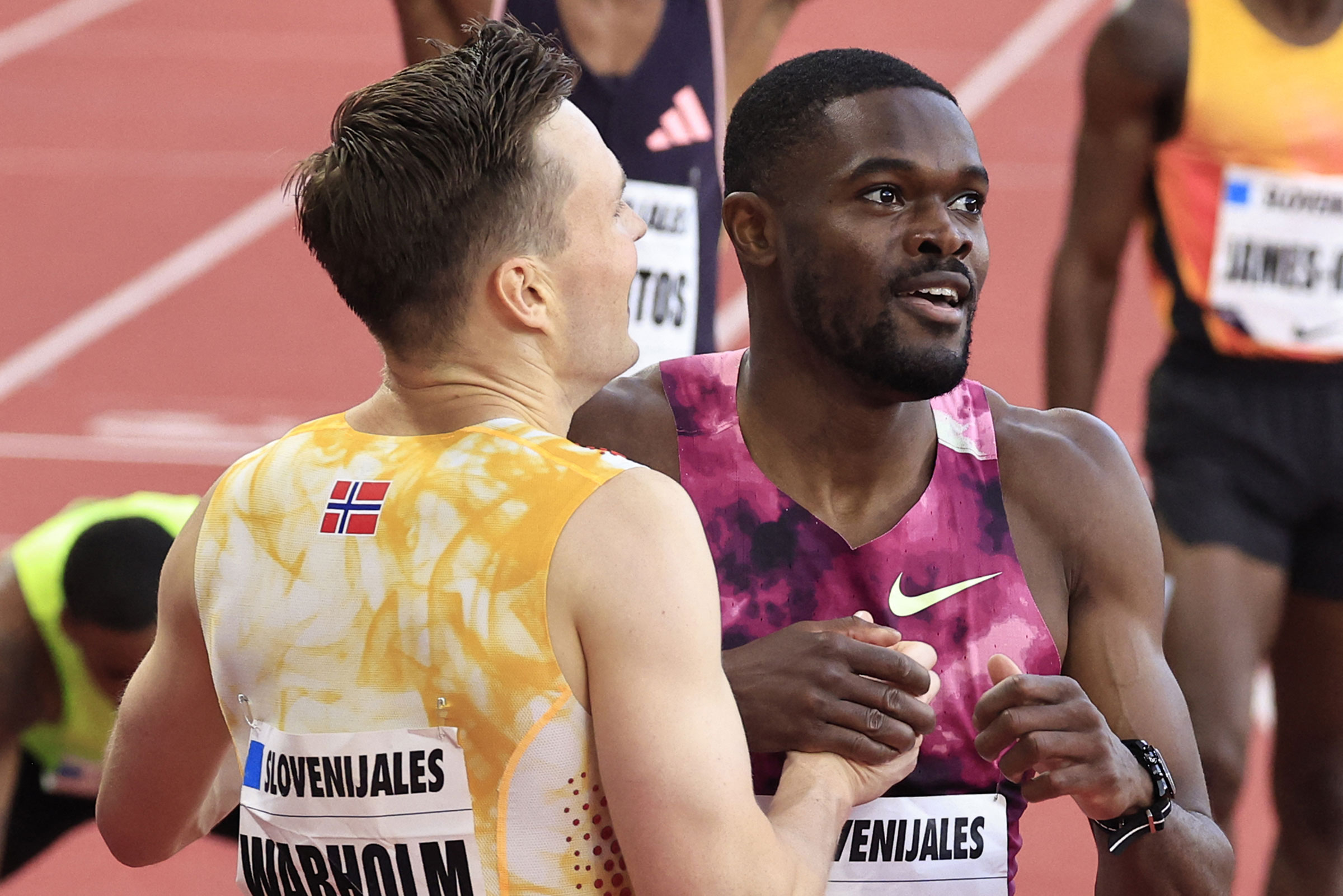 Norway's Karsten Warholm (L) and Rai Benjamin of the U.S. (R) react after the men's 400m hurdles event during the 'Wanda Diamond League' athletics meeting at the Louis II stadium in Monaco on July 12, 2024.