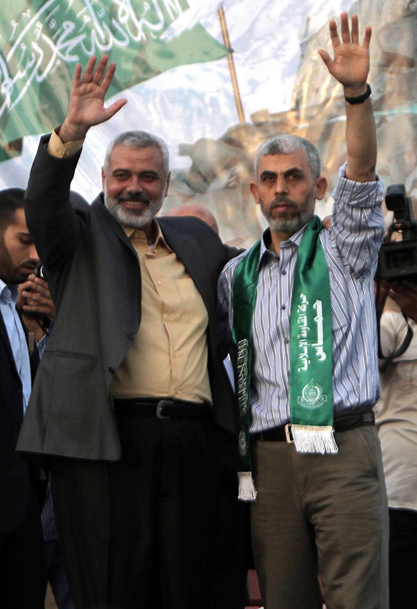 Hamas leader Ismail Haniya and Yahya Sinwar, a founder of Hamas' military wing, wave as supporters celebrate the release of hundreds of prisoners, including Sinwar, following a swap for captured Israeli soldier Gilad Shalit in 2011.